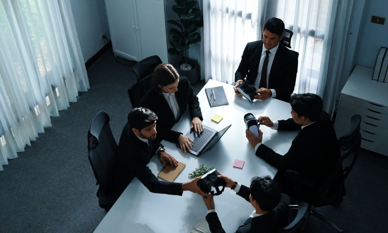 Professional business meeting with team collaboration around a conference table